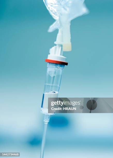 close-up of iv drip bag in operation room - saline drip stock pictures, royalty-free photos & images