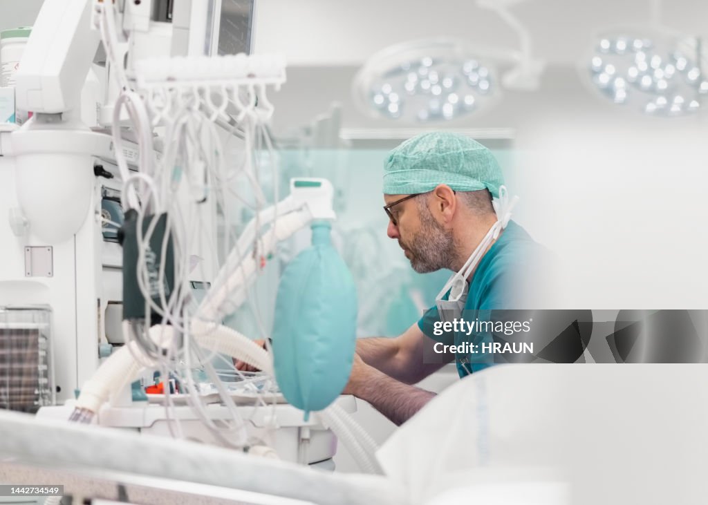 Male doctor working in operation room