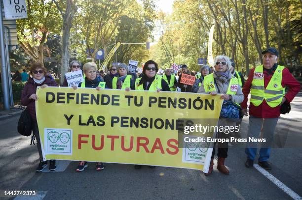 Group of people hold a banner at a demonstration to demand an improvement in pensions and salaries in line with the real CPI, on 19 November, 2022 in...