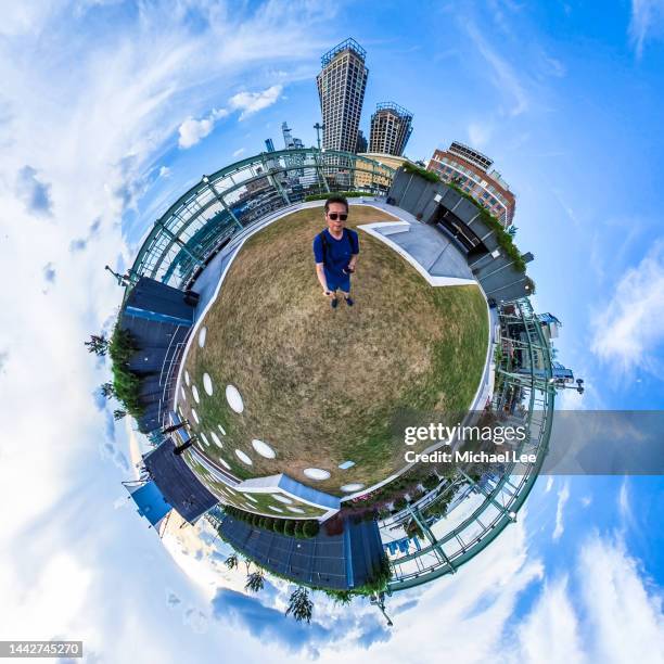 tiny planet view of rooftop park and midtown manhattan - 360 people stock-fotos und bilder