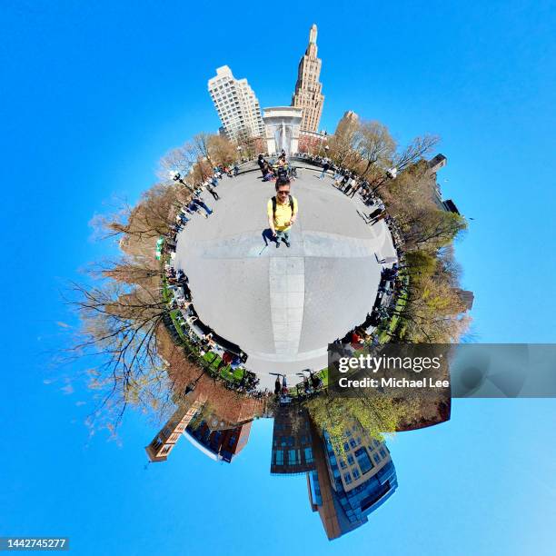 tiny planet view of washington square park in new york - 360 people stock-fotos und bilder