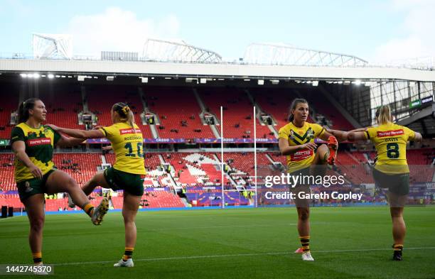 Julia Robinson, Jessica Sergis and Keeley Davis of Australia warm up prior to the Women's Rugby League World Cup Final match between Australia and...