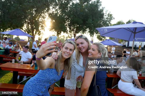 Three ladies take a selfie during Day Three of the DP World Tour Championship on the Earth Course at Jumeirah Golf Estates on November 19, 2022 in...