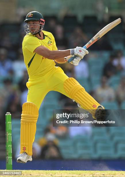 Marcus Stoinis of Australia leaps as he bats during Game 2 of the One Day International series between Australia and England at Sydney Cricket Ground...