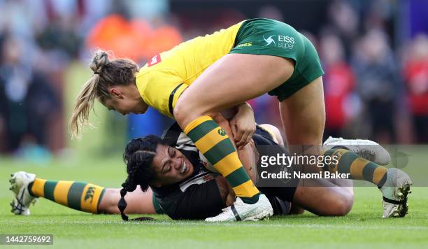 Roxy Murdoch-Masila of New Zealand is tackled by Kezie Apps of Australia during the Women's Rugby League World Cup Final match between Australia and...