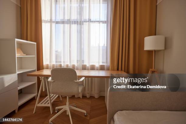empty workplace in children's room at home - bed sun stock pictures, royalty-free photos & images