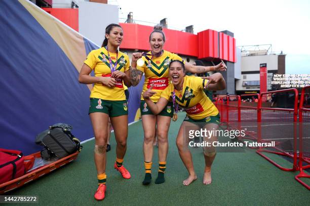 Shaylee Bent, Holli Wheeler and Shannon Mato of Australia celebrate with their Women's Rugby League World Cup winners medal following the Women's...