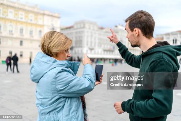 tourist asking for help on the street - doing a favour stock pictures, royalty-free photos & images
