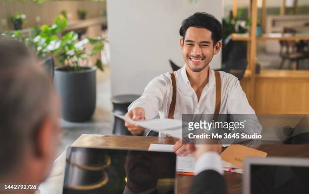male job applicant talking to manager human resources. - successful candidate stock pictures, royalty-free photos & images
