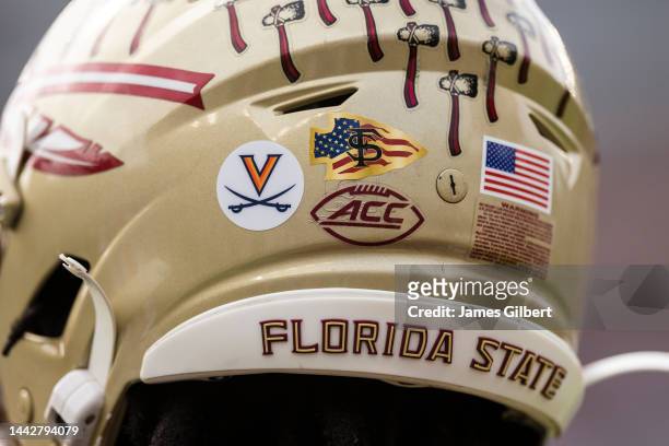 Detailed view of a University of Virginia helmet sticker on an Florida State Seminoles helmet, in honor of the three Virginia football players who...