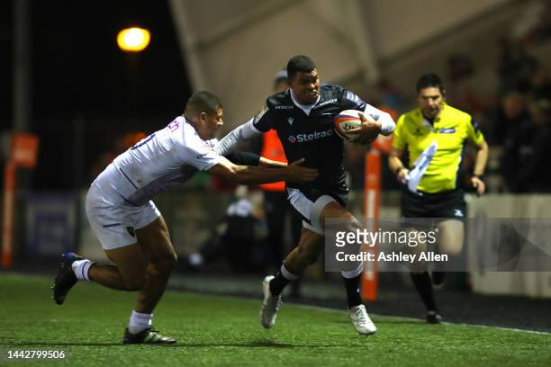 Nathan Earle of Newcastle Falcons is tackled during the Premiership Rugby Cup match between Newcastle Falcons and Northampton Saints at Kingston Park...