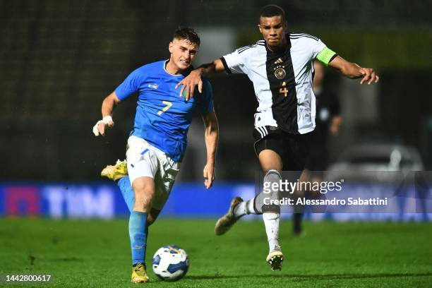 Lorenzo Colombo of Italy U21 competes for the ball with Malick Thiaw of Germany U21during the International Friendly match between Italy U21 and...