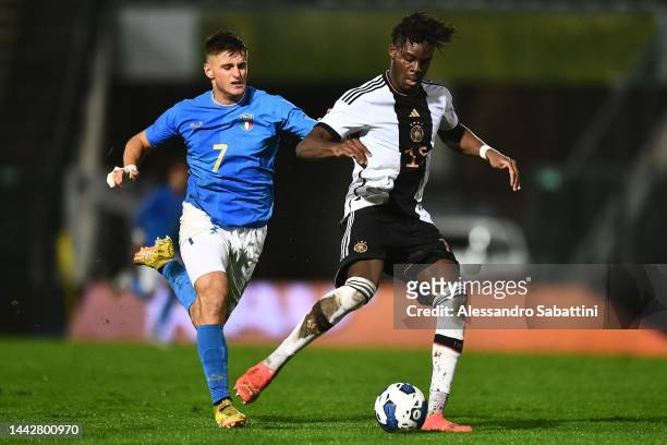 Lorenzo Colombo of Italy U21 competes for the ball with Yann Aurel Bisseck of Germany U21during the International Friendly match between Italy U21...