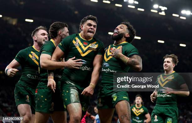 Latrell Mitchell of Australia celebrates with teammate Josh Addo-Carr after scoring their team's sixth try during the Rugby League World Cup Final...