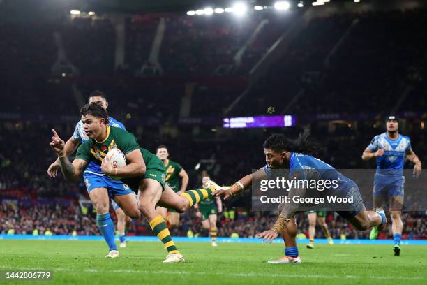 Latrell Mitchell of Australia touches down for their team's sixth try during the Rugby League World Cup Final match between Australia and Samoa at...