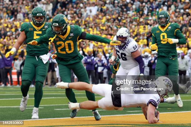 Quarterback Max Duggan of the TCU Horned Frogs scores a touchdown against safety Devin Lemear of the Baylor Bears in the first quarter at McLane...