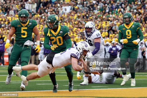 Quarterback Max Duggan of the TCU Horned Frogs scores a touchdown against safety Devin Lemear of the Baylor Bears in the first quarter at McLane...