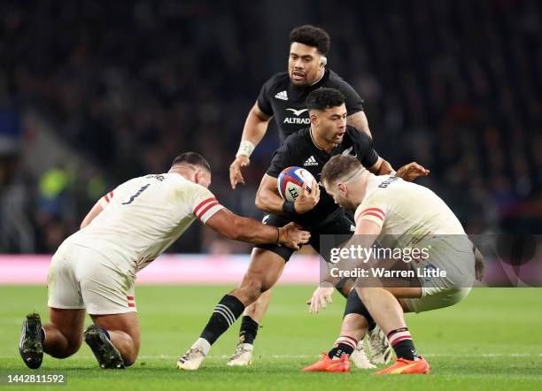 Richie Mo'unga of New Zealand is tackled by Ellis Genge of England during the Autumn International match between England and New Zealand at...