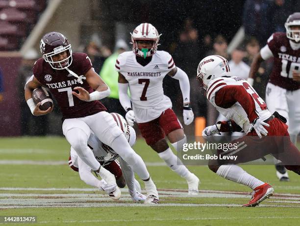 Moose Muhammad III of the Texas A&M Aggies runs with the ball after a catch against the Massachusetts Minutemen during the first quarter at Kyle...