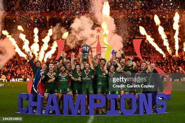 James Tedesco of Australia lifts the Rugby League World Cup trophy with teammates following victory in the Rugby League World Cup Final match between...