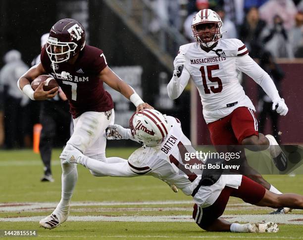 Moose Muhammad III of the Texas A&M Aggies avoids gthe tackle attempt by Javon Batten of the Massachusetts Minutemen during the second quarter at...