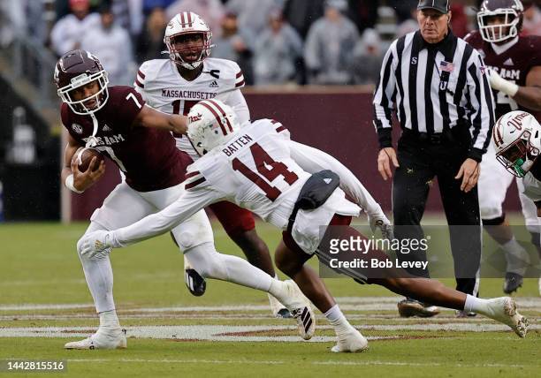 Moose Muhammad III of the Texas A&M Aggies avoids gthe tackle attempt by Javon Batten of the Massachusetts Minutemen during the second quarter at...
