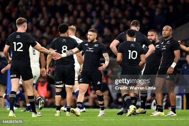 Perenara of New Zealand interacts with teammate Jordie Barrett during the Autumn International match between England and New Zealand at Twickenham...