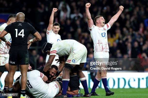 Owen Farrell of England celebrates as Will Stuart of England scores their sides third try during the Autumn International match between England and...