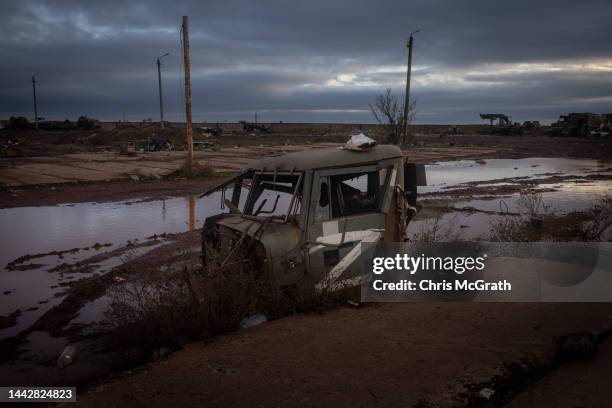 Part of a destroyed Russian military vehicle is seen at a base used by Russian forces outside Kherson International Airport on November 19, 2022 in...