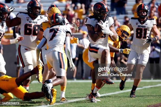 Running back Damien Martinez of the Oregon State Beavers scores a touchdown during the first half against the Arizona State Sun Devils at Sun Devil...