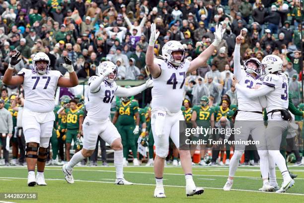 Place kicker Griffin Kell of the TCU Horned Frogs celebrates with punter Jordy Sandy, offensive tackle Brandon Coleman, tight end Alex Honig and...