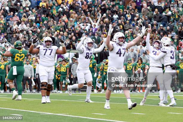Place kicker Griffin Kell of the TCU Horned Frogs celebrates with punter Jordy Sandy, offensive tackle Brandon Coleman, tight end Alex Honig and...
