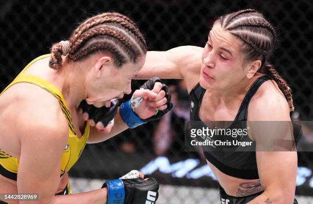 Jennifer Maia of Brazil punches Maryna Moroz of Ukraine in a flyweight fight during the UFC Fight Night event at UFC APEX on November 19, 2022 in Las...
