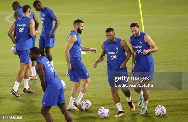 Karim Benzema, Kylian Mbappe, Adrien Rabiot of France during Team France practice ahead of the FIFA World Cup Qatar 2022 at Al Sadd SC Stadium on...