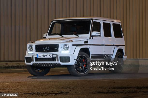 mercedes-amg g63 on a street - mercedes amg stock pictures, royalty-free photos & images