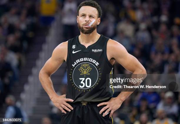 Stephen Curry of the Golden State Warriors looks on against the New York Knicks during the first quarter of an NBA basketball game at Chase Center on...