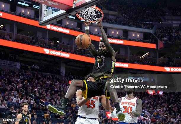 JaMychal Green of the Golden State Warriors slam dunks against the New York Knicks during the fourth quarter of an NBA basketball game at Chase...
