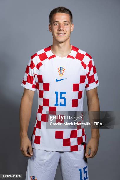 Mario Pasalic of Croatia poses during the official FIFA World Cup Qatar 2022 portrait session on November 19, 2022 in Doha, Qatar.