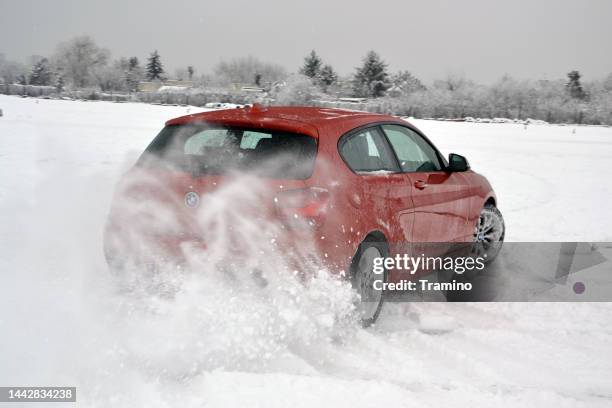 bmw m135i in motion in winter scenery - snöyra bildbanksfoton och bilder