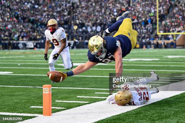 Michael Mayer of the Notre Dame Fighting Irish dives just short of the touchdown in the first half against Josh DeBerry of the Boston College Eagles...