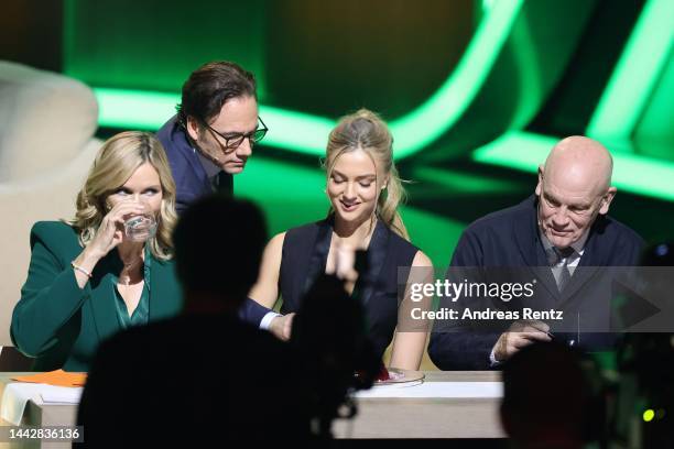 Veronica Ferres, Michael Herbig, Lilly Krug and John Malkovich speak on stage during the "Wetten, dass...?" Live Show on November 19, 2022 in...