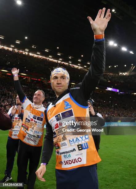 Kevin Sinfield, former Rugby League player, acknowledges the fans at half time after completing their Ultra 7 in 7 Challenge during the Rugby League...