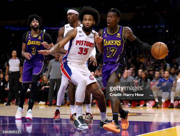 Dennis Schroder of the Los Angeles Lakers looks to make a pass in front of Marvin Bagley III of the Detroit Pistons during a 128-121 Lakers win at...