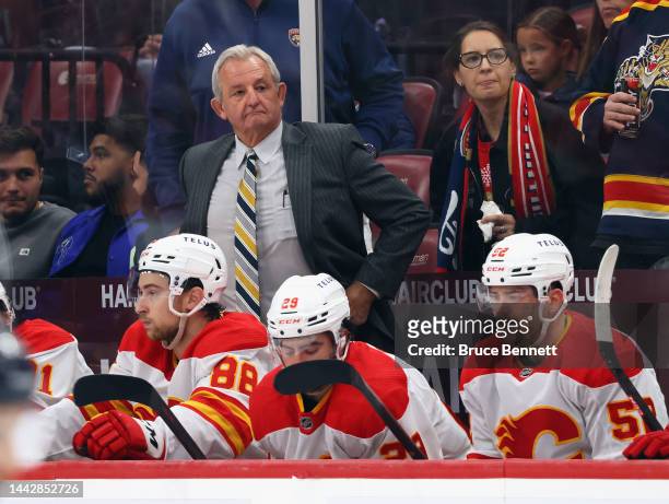 Head coach Darryl Sutter of the Calgary Flames handles the bench during the third period against the Florida Panthers at FLA Live Arena on November...