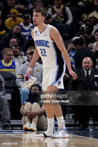 Franz Wagner of the Orlando Magic holds one of his shoes after it came off his foot in the first quarter against the Indiana Pacers at Gainbridge...