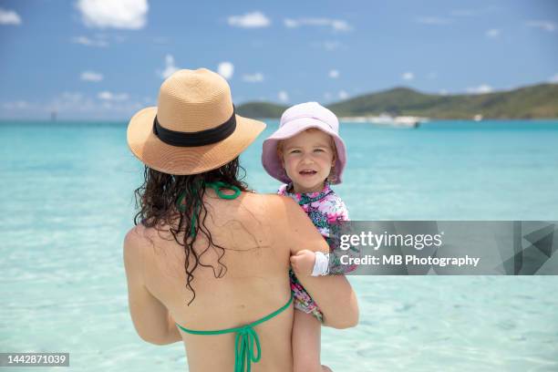 mother and daughter enjoying beach - whitehaven beach stock pictures, royalty-free photos & images