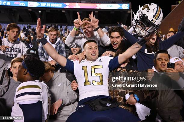 Zach Gibson of the Georgia Tech Yellow Jackets celebrates with fans after their win against the North Carolina Tar Heels at Kenan Memorial Stadium on...