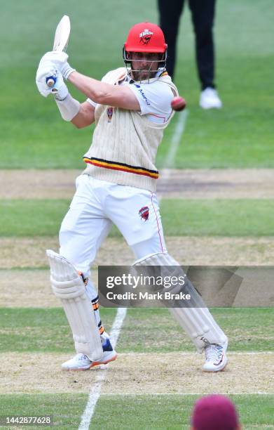 Jake Lehmann of the Redbacks cuts and is caught by Sam Heazlett of the Queensland Bulls during the Sheffield Shield match between South Australia...