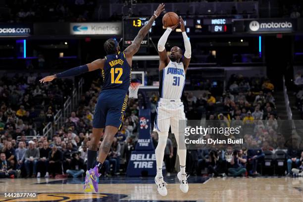 Terrence Ross of the Orlando Magic attempts a shot while being guarded by Oshae Brissett of the Indiana Pacers in the third quarter at Gainbridge...