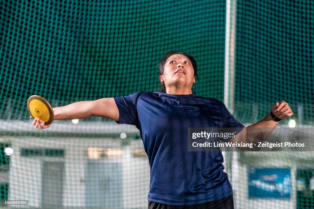 Discus In Track And Field Track And Field Female Discus Thrower In Action High-Res Stock Photo ...